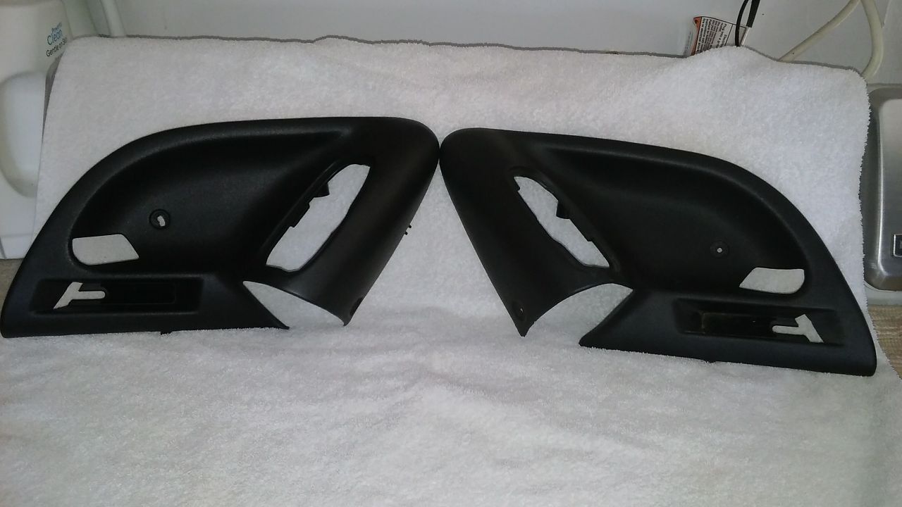 Camaro 2002 Ebony door handle bezel trim.