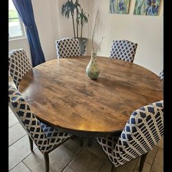 6 Ft DIAMETER DINING ROOM TABLE WITH 6 CHAIRS.    When Purchased brand new 4 years ago $8500.