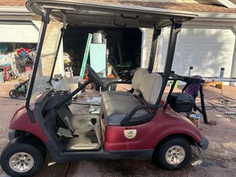 2 golf Carts yamaha and Cadillac