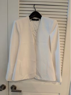 Zara Woman cape blazer with a collarless, open-front design.