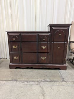 Traditional Dark Wood Dresser with Ornate Hardware