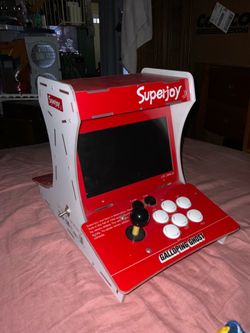a "Superjoy" branded double-sided mini bartop arcade machine featuring a collaboration decal styled after the famous Galloping Ghost Arcade.