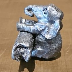 MINIATURE BABY ELEPHANT PEWTER FIGURINE CLIMBING OVER A LOG MADE IN THE USA