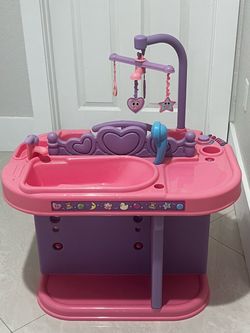 Constructive Playthings Baby Doll Changing Table with Accessories, pink and purple