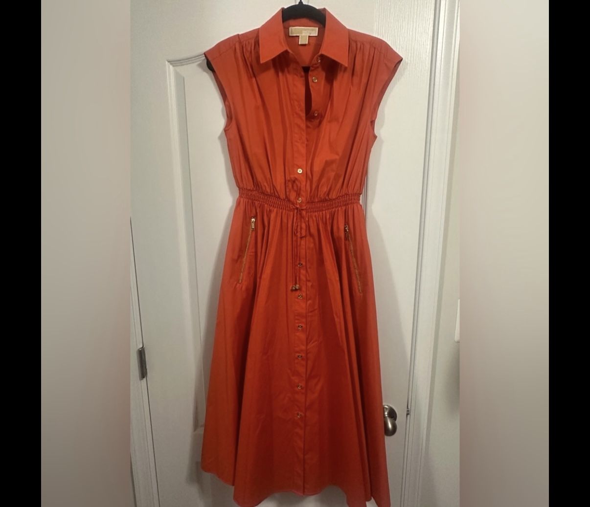 Vibrant Orange Sleeveless Dress with Gold Accents