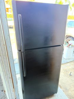 Frigidaire black refrigerator and top freezer