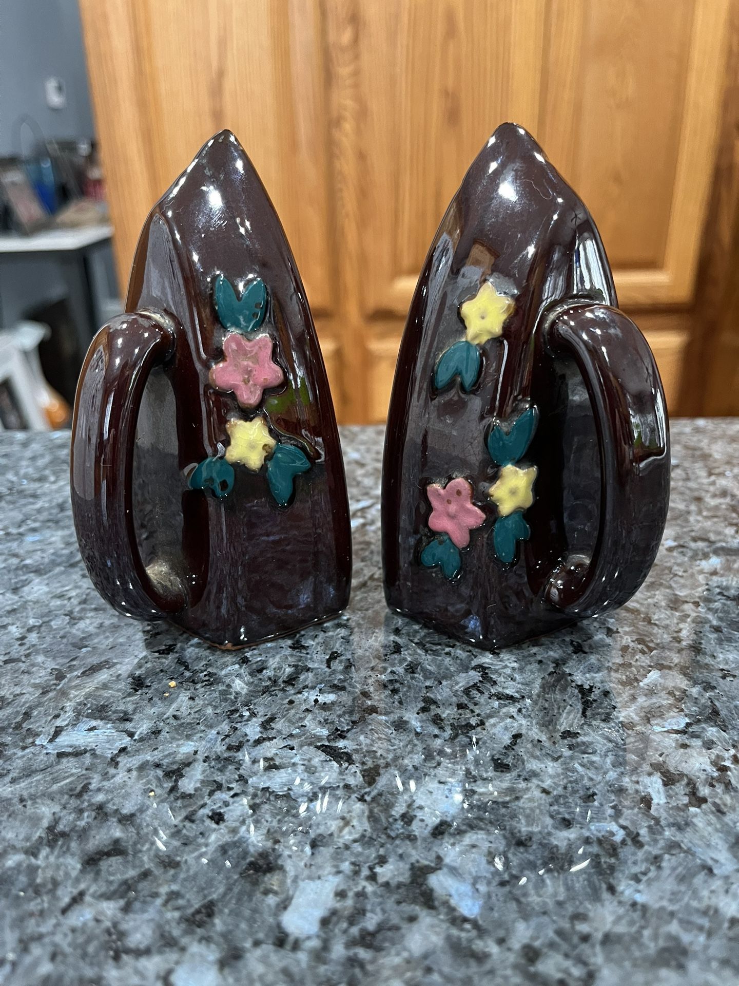 Vintage Red Clay Irons Brown Glossy with Flowers pair of salt and pepper shakers. Size approximately 4 3/4 inches tall. Preowned