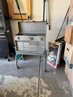 Toolbox with rollers and tools