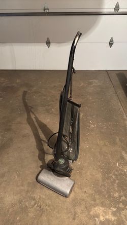 Antique Hoover vacuum cleaner with attachments