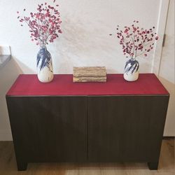 IKEA BESTÅ storage combination with doors, black and brown.