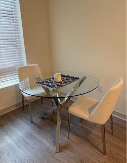 Glass and chrome round dining table