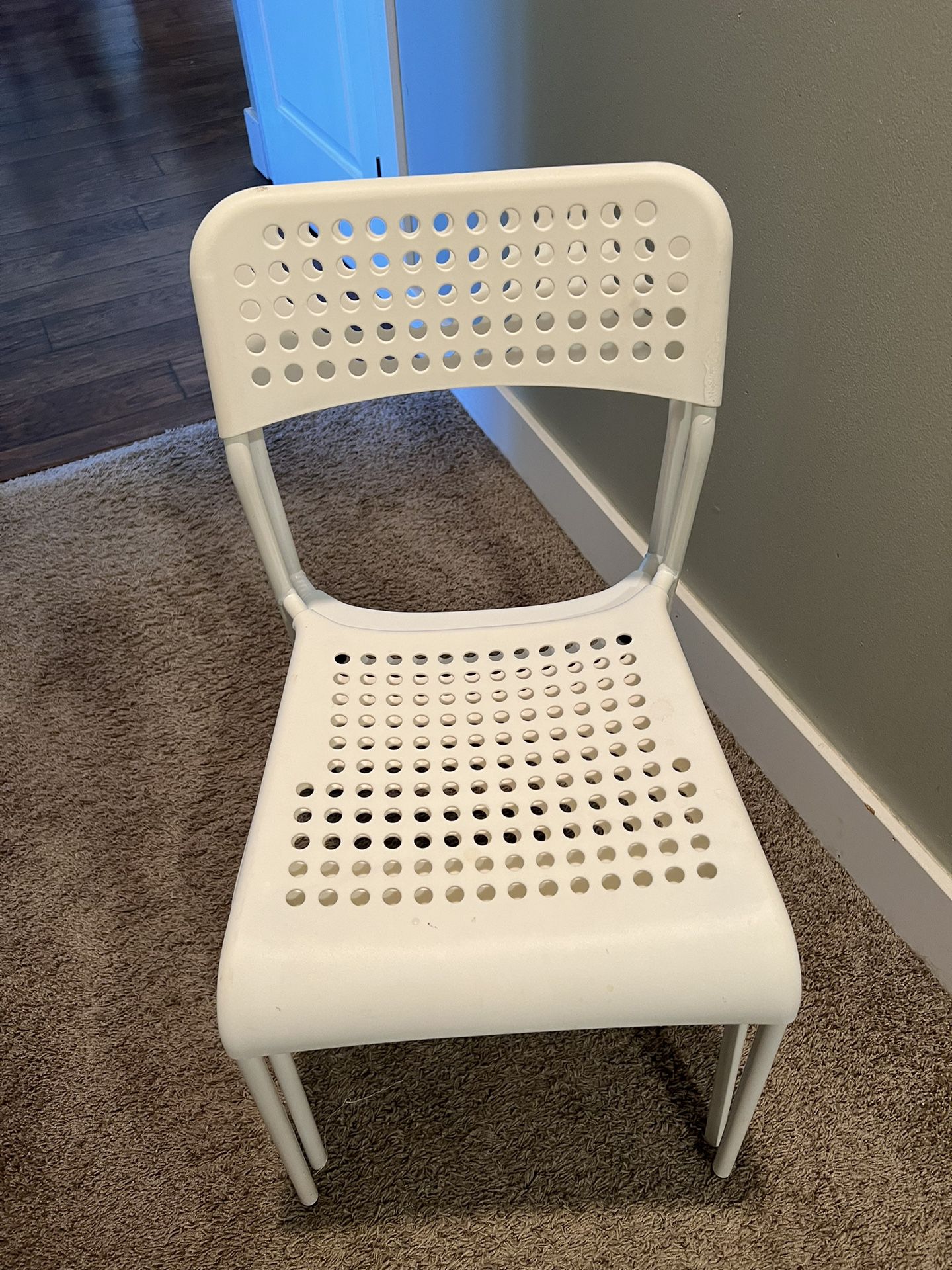 2 White Plastic Stackable Chairs