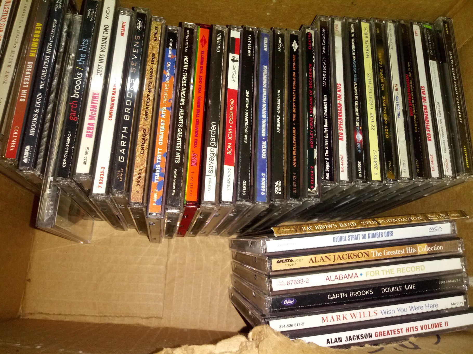 37 country and rock cds with 2 cases