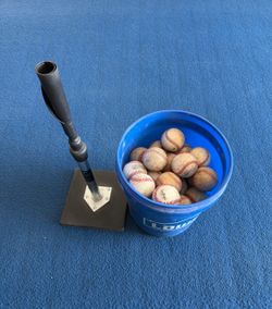 Original Tanner Tee w/bucket of leather baseballs