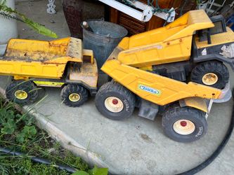 Three Tonka Trucks.