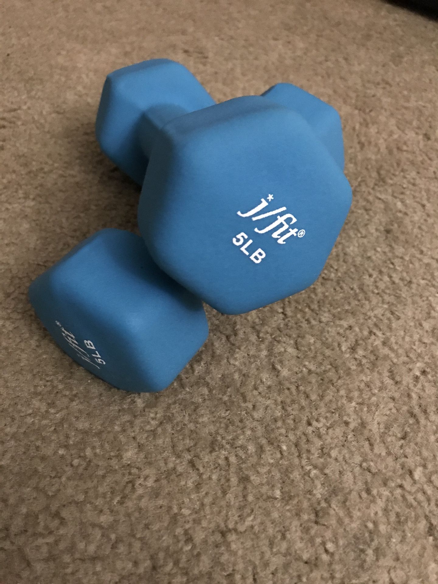 A pair of 5 lbs dumbbells