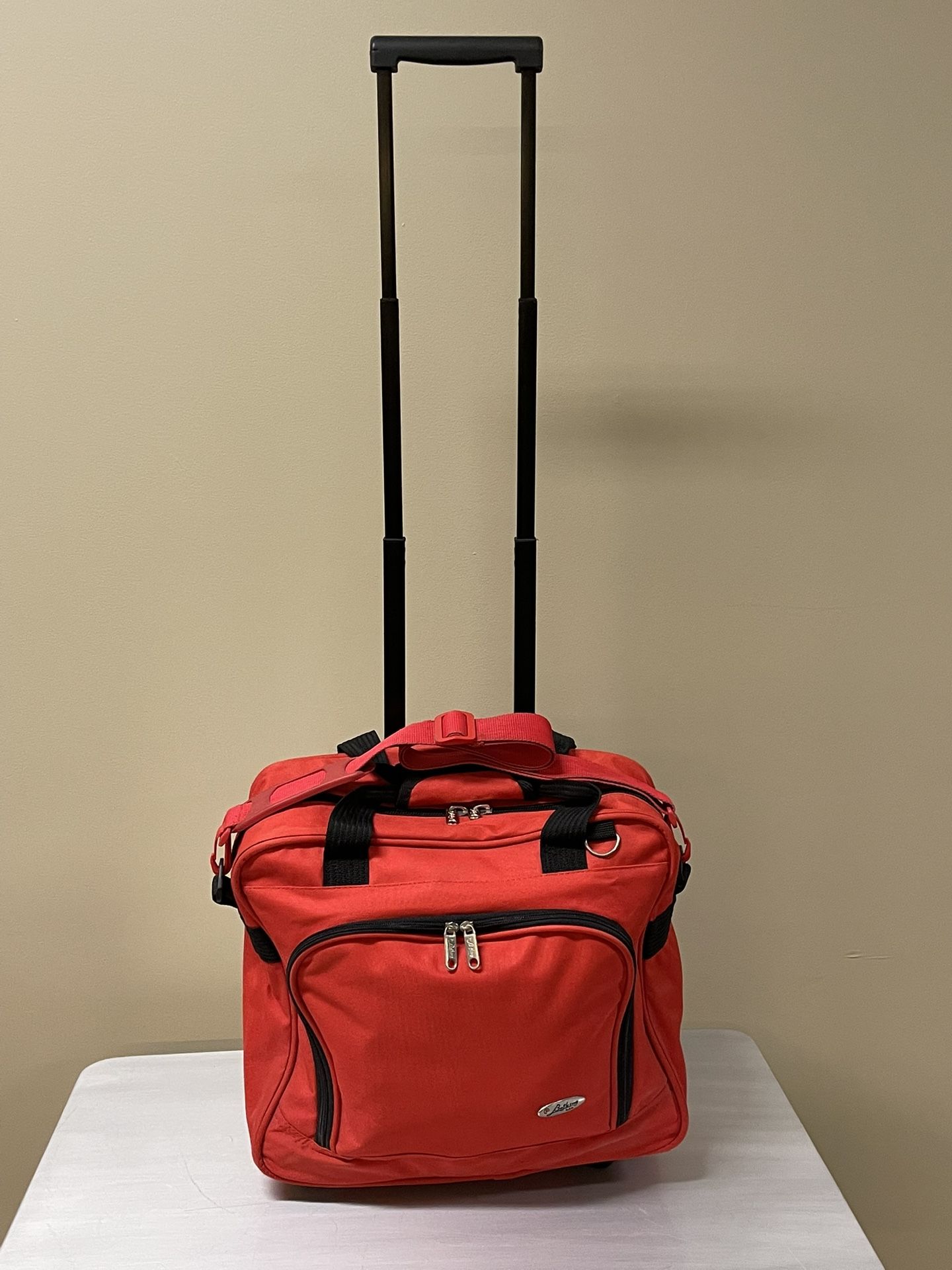SMALL (15"H x 16"W), LIGHTWEIGHT, TWO (2) WHEEL, RED CARRY-ON LUGGAGE - posted price is firm.