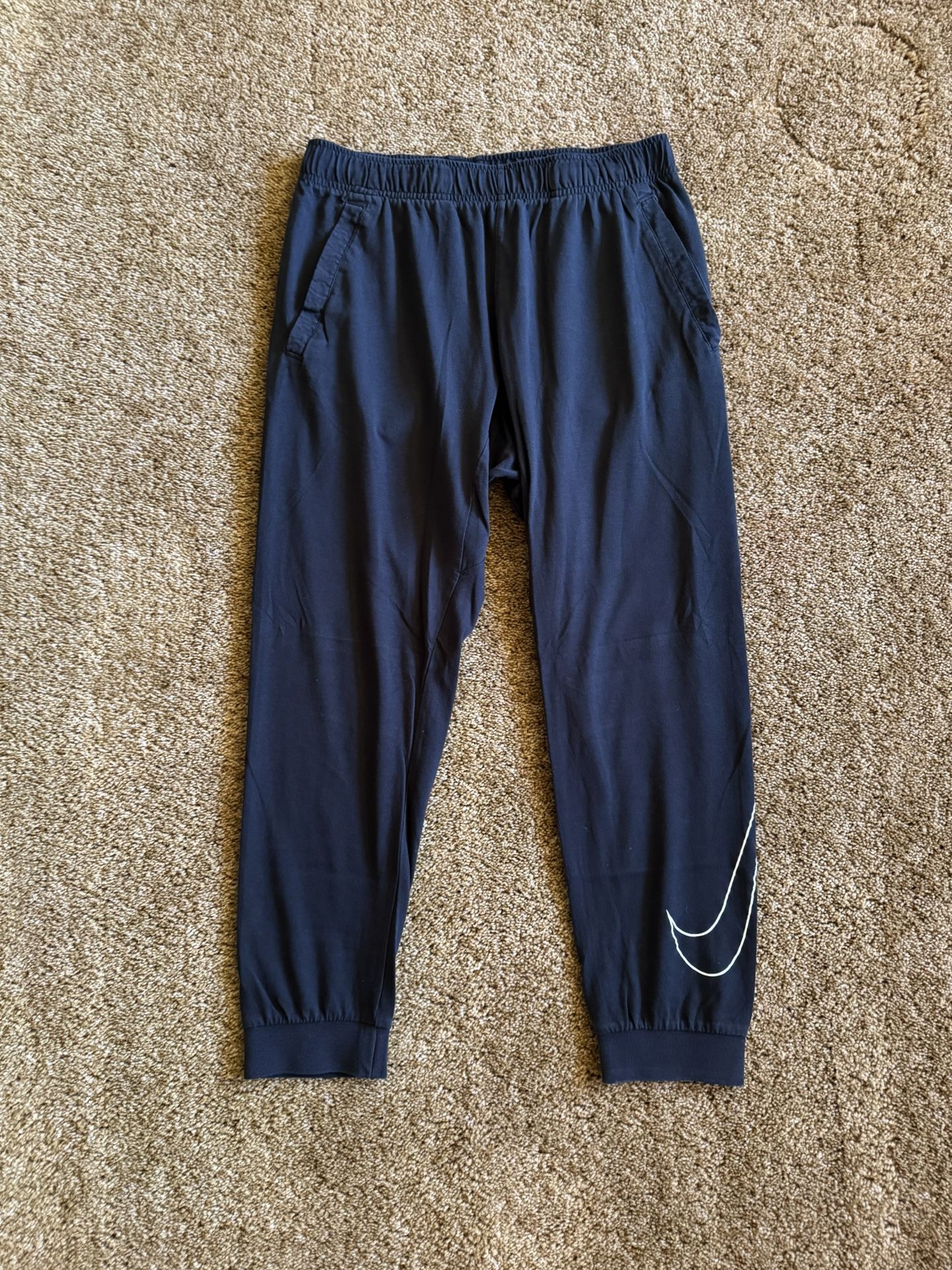 Nike joggers with white swoosh; perfect condition