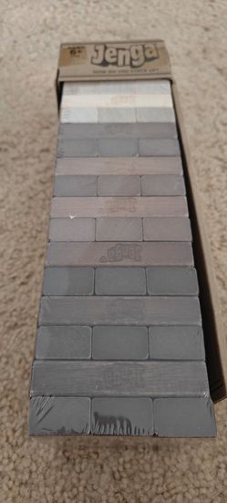 NEW with sealed...Hasbro Jenga game, which includes 54 hardwood blocks.