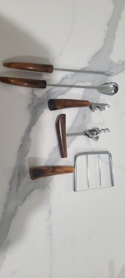 Bottle opener and cheese slicer