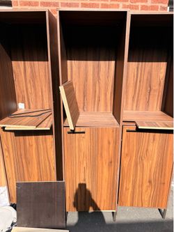 3 wood storage cabinets with shelving