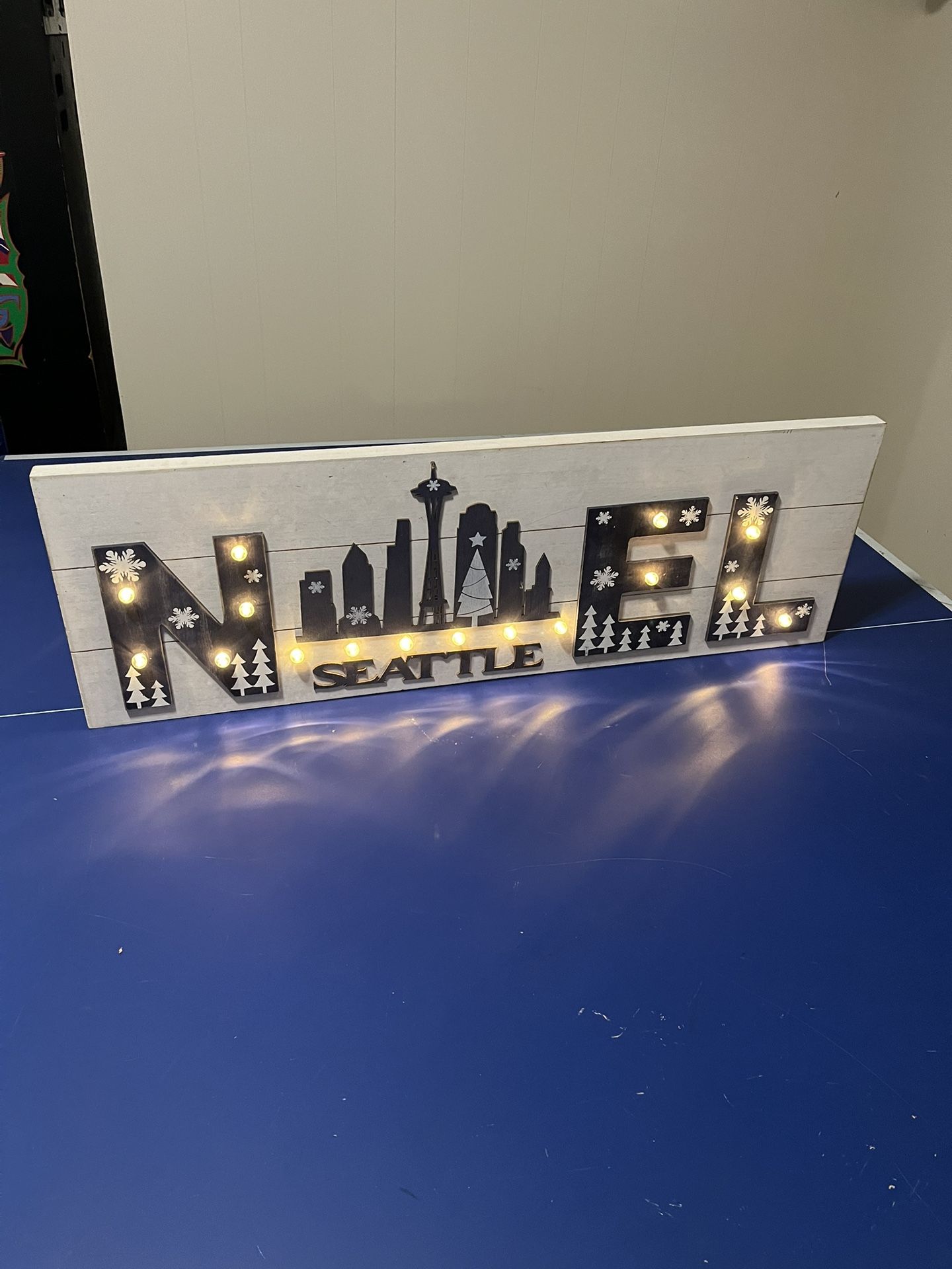 This is a decorative wooden Seattle landmark sign featuring the Space Needle and city skyline.