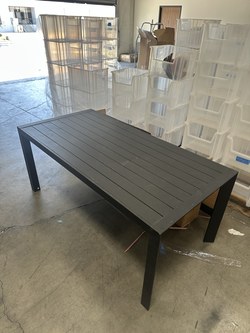 Black slatted outdoor dining / display table