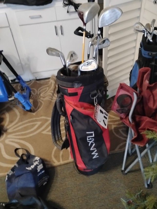 Couple Golf Clubs And Bag