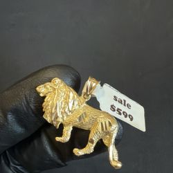 Gold lion pendant