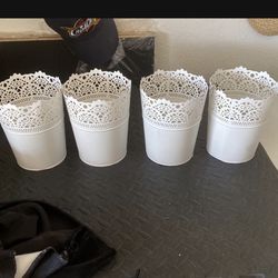 Four metal plant pots