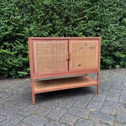 2 Door Cabinet with caned rattan detailing and a natural wood finish