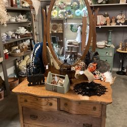 Antique dresser with oval mirror