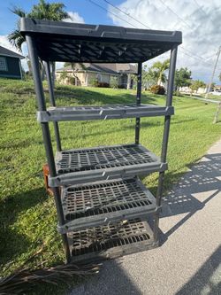 Black plastic shelving unit