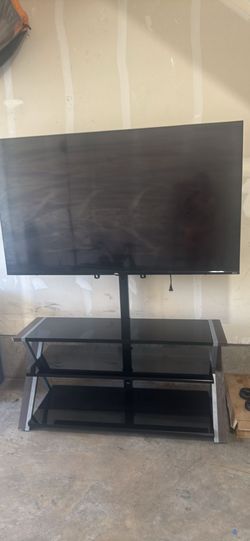 Roku 65 inch flat screen TV  with TV stand
