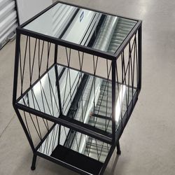Mirrored shelf with metal frame