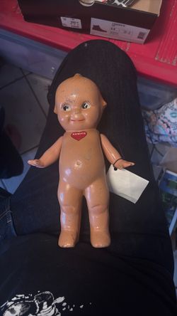Original kewpie doll with red hart on the chest.