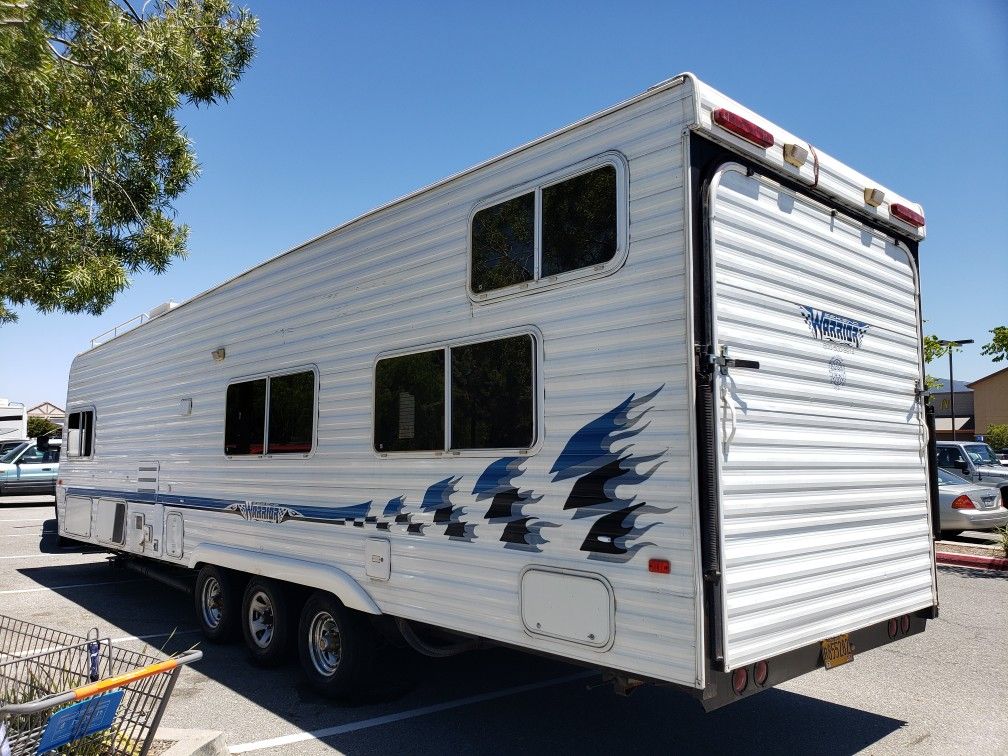 2003 Weekend Warrior 31' Toy Hauler, Triple Axle, Front Bedroom for