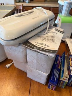 Food sealer with 4 boxes of bags