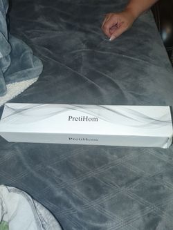 Brand new curling iron in the box