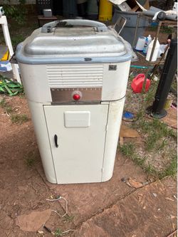 Vintage Westinghouse roaster and cabinet .  It needs a good cleaning from being in storage