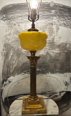 Antique Table Lamp featuring a yellow embroised glass shade & brass Corinthian base. 23” tall. Available in Coral Gables760. Cash please