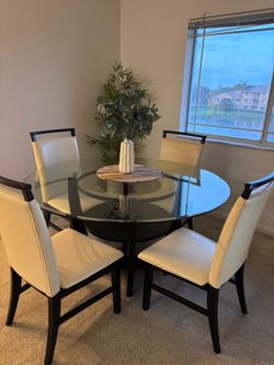 A dining table with chairs