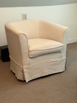 Cream colored swivel chair