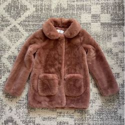 Girl’s collared faux fur coat from H&M in a dusty pink shade, size 10