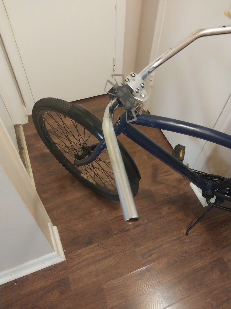 2 Bycycles, One With Motor. 