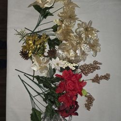 Assorted artificial flowers in gold, red, and white