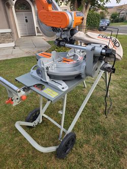 12" sliding miter saw and stand  Ridgid
