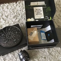 Sparkpod 8 inch oil rubbed bronze adjustable 7 function high pressure shower head with filter.  In original box, essentially new. Husband installed an