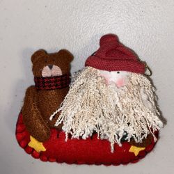 Santa & bear on a red canoe plush Christmas ornament