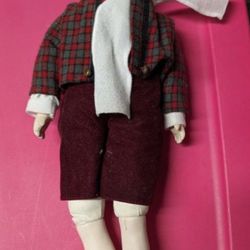Vintage Anco Porcelain Boy Doll in Winter outfit.